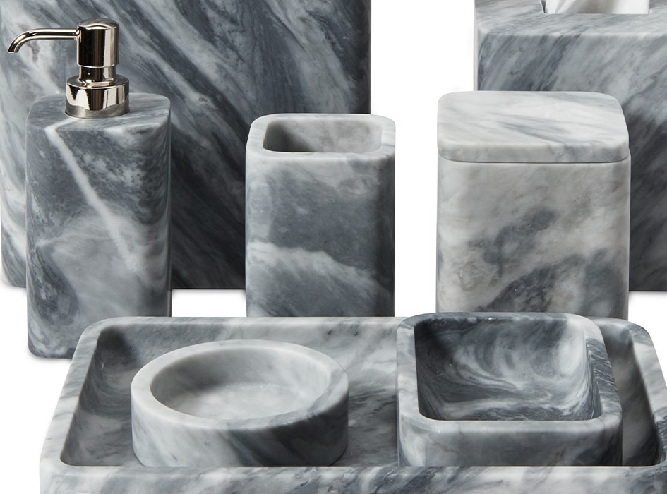 Hand-carved from solid blocks of marble, these beautiful bath accessories come in rounded modern shapes.