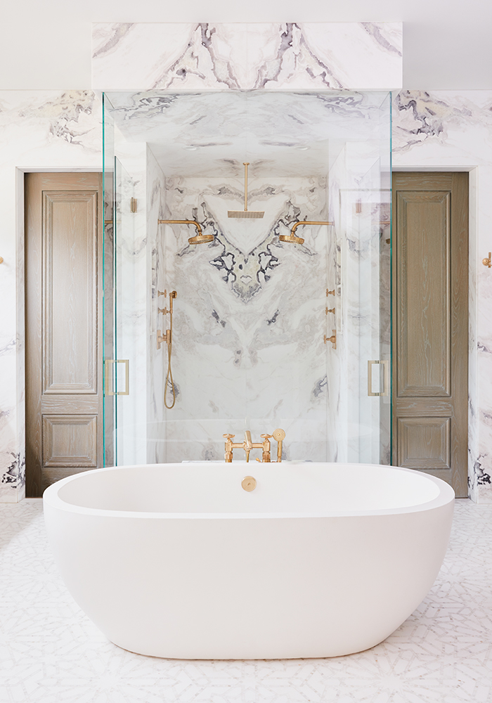 Bathroom, White Tub, Gold Tub Filler, Large Stone Wall 
